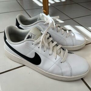 Men’s size 10.5 Nike tennis shoes, white and black sneakers